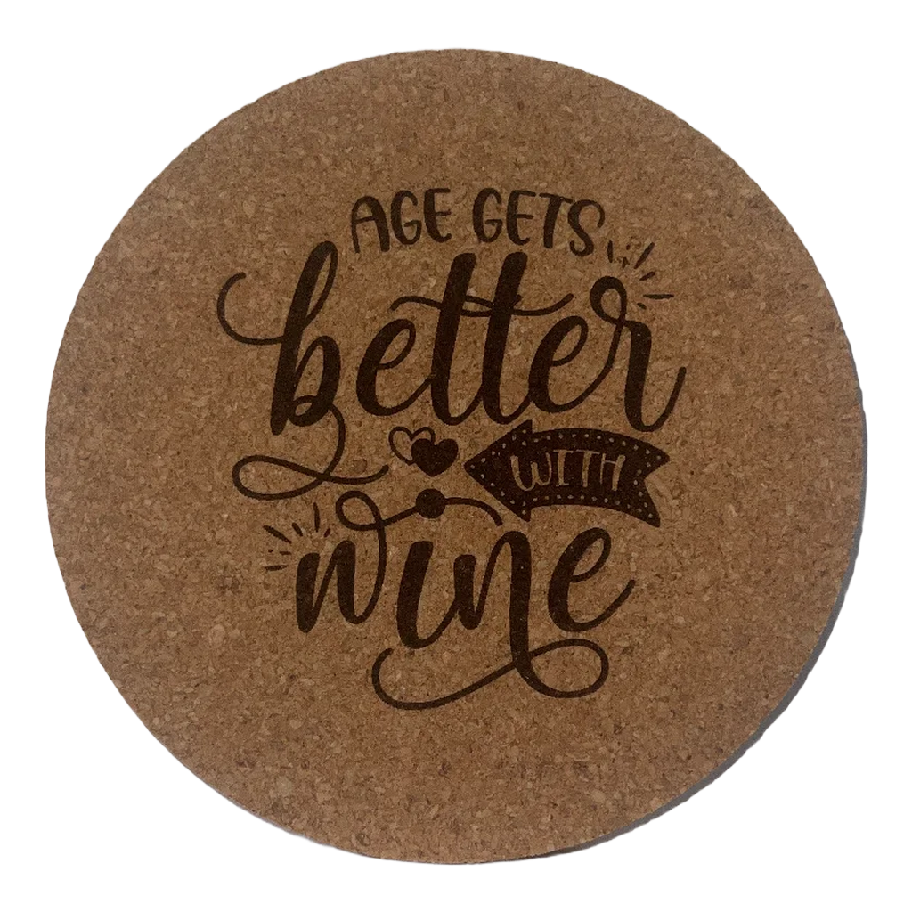 Round cork coaster with 'Age gets better with wine' text on a white background
