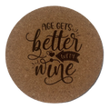 Round cork coaster with 'Age gets better with wine' text on a white background