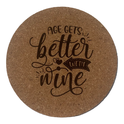 Round cork coaster with 'Age gets better with wine' text on a white background